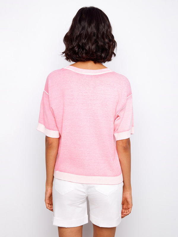 Crafted from 100% cotton, this pink top delivers breathability and softness. A perfect choice for warm weather by Charlie B.