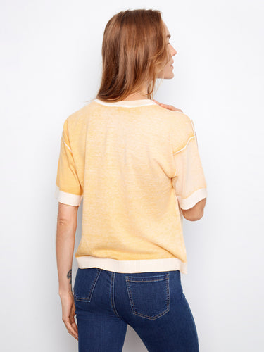 Stylish yellow shirt highlighting a reverse print pattern, adding a touch of creativity to your wardrobe. By Charlie B.