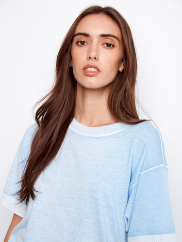 Elegant blue sweater with a unique reverse print design, crafted from pure cotton for style and breathability by Charlie B.