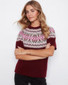 This sweater features a crew neckline and showcases a charming geometric pattern with pink accents. By Charlie B.