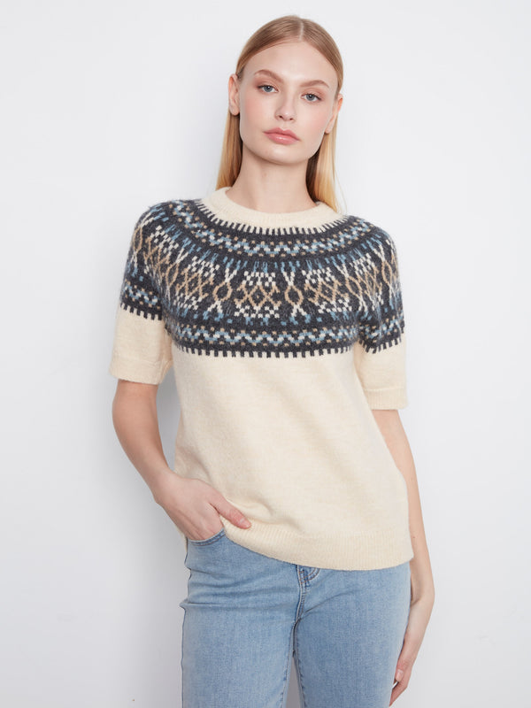 Ecru sweater with a crew neckline, featuring a geometric pattern and soft brushed knit for a cozy feel by Charlie B.
