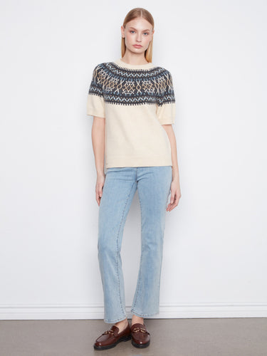 Soft brushed knit ecru sweater highlighted by a striking geometric pattern on the upper section by Charlie B.