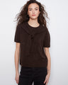 The sweater features a classic crew neckline, adding a touch of elegance to its design by Charlie B.