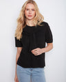 Elegant black sweater in soft knit fabric with attached detail by Charlie B.