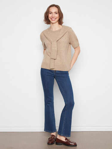 Features an attached sweater detail that adds uniqueness and versatility to your wardrobe. By Charlie B.
