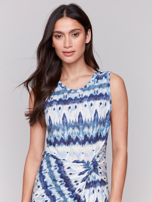 Dress featuring an abstract pattern and faux knot waist by Charlie B.