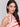 Vibrant begonia-striped crochet garment exuding style and comfort, by Charlie B.