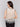 Natural color top featuring a floral crochet border by Charlie B.