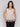 Elegant sleeveless design in breathable fabric by Charlie B.