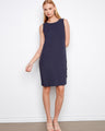 Navy sleeveless shift dress featuring a straight silhouette and decorative buttons on the side by Charlie B.