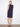 Knee-length navy shift dress with a sophisticated straight silhouette, enhanced by side buttons by Charlie B.