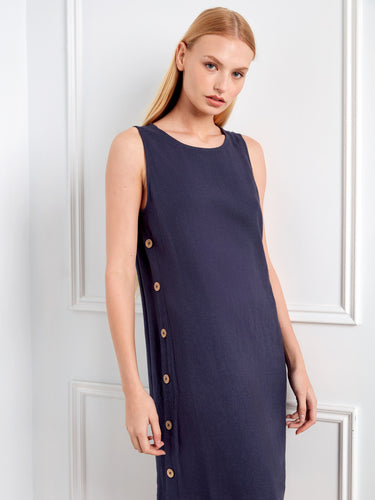 Stylish navy dress showcasing decorative side button detail and crew neckline for an elegant appeal by Charlie B.