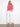 Drawcord hem adds versatility to this vibrant pink top, paired with white bottoms. By Charlie B.