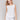 White linen blend top with crew neckline, featuring a relaxed silhouette by Charlie B.