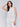 White linen top featuring a crew neckline by Charlie B.