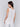 Sleeveless white linen top with scalloped hem by Charlie B.