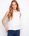 White linen top featuring a high-low hem and side button detailing for a chic look by Charlie B.