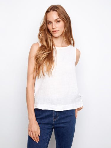 Elevate your style with the high-low hem on this versatile white linen top by Charlie B.