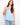 Light blue sleeveless top featuring a scoop neckline, perfect for warm weather. Crafted with elegance and comfort by Charlie B.