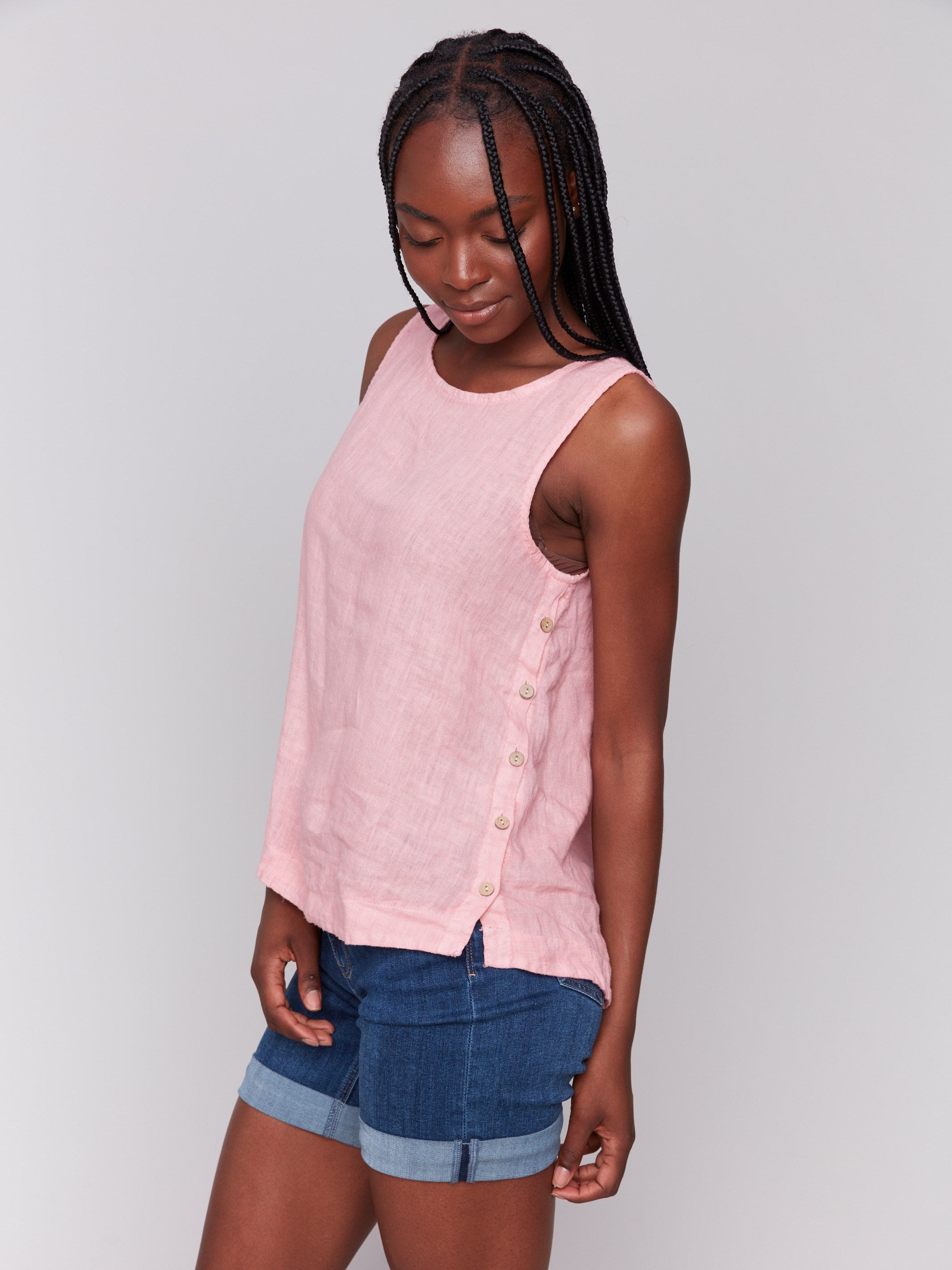 Linen tank top with sleeveless design and side button detailing by Charlie B.