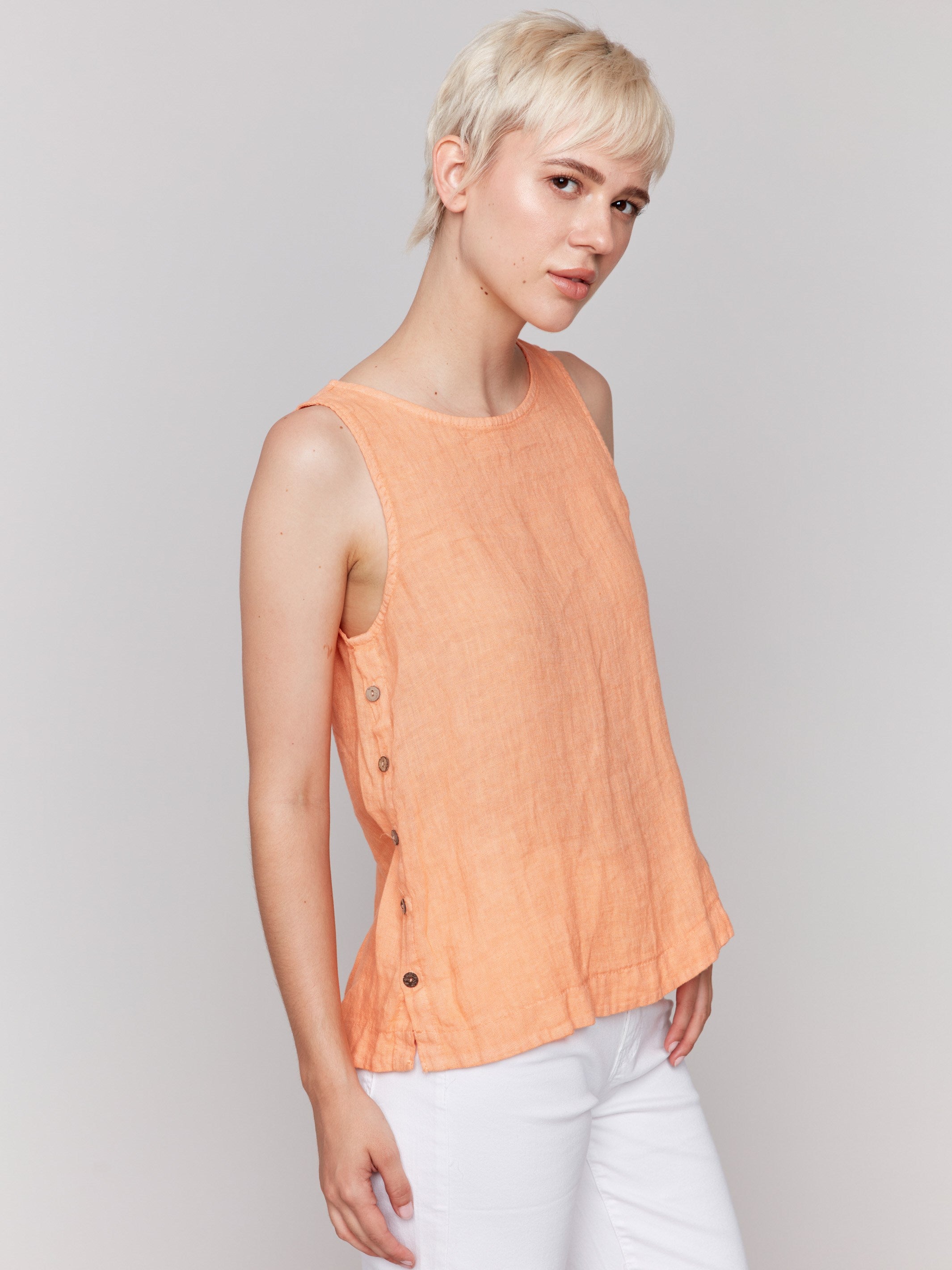 Sleeveless papaya tank top with unique side buttons by Charlie B.