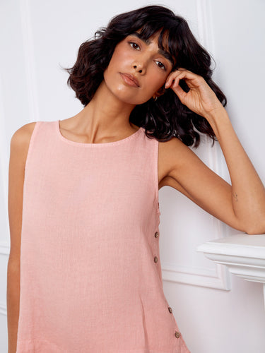 Side button detailing enhances the chic look of this pink top, adding subtle sophistication to your outfit choices. By Charlie B.