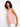 This sleeveless pink blouse is designed with side button accents that offer both style and functionality in one piece. By Charlie B.