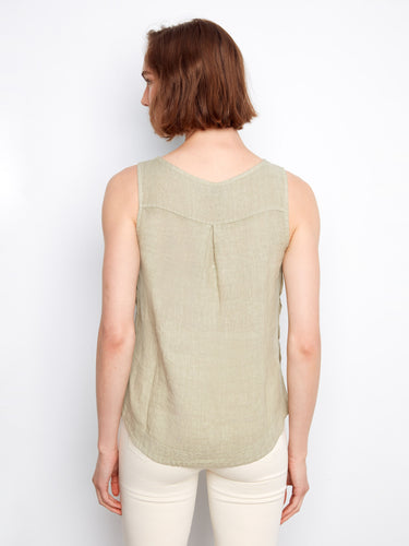 A beautifully crafted sleeveless design in soft linen offers comfort and style for warm weather days by Charlie B.