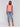 Linen top in watermelon with a stylish slit at the hem by Charlie B.