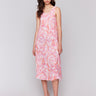 Flowy silhouette dress with a papaya tie-dye design by Charlie B.