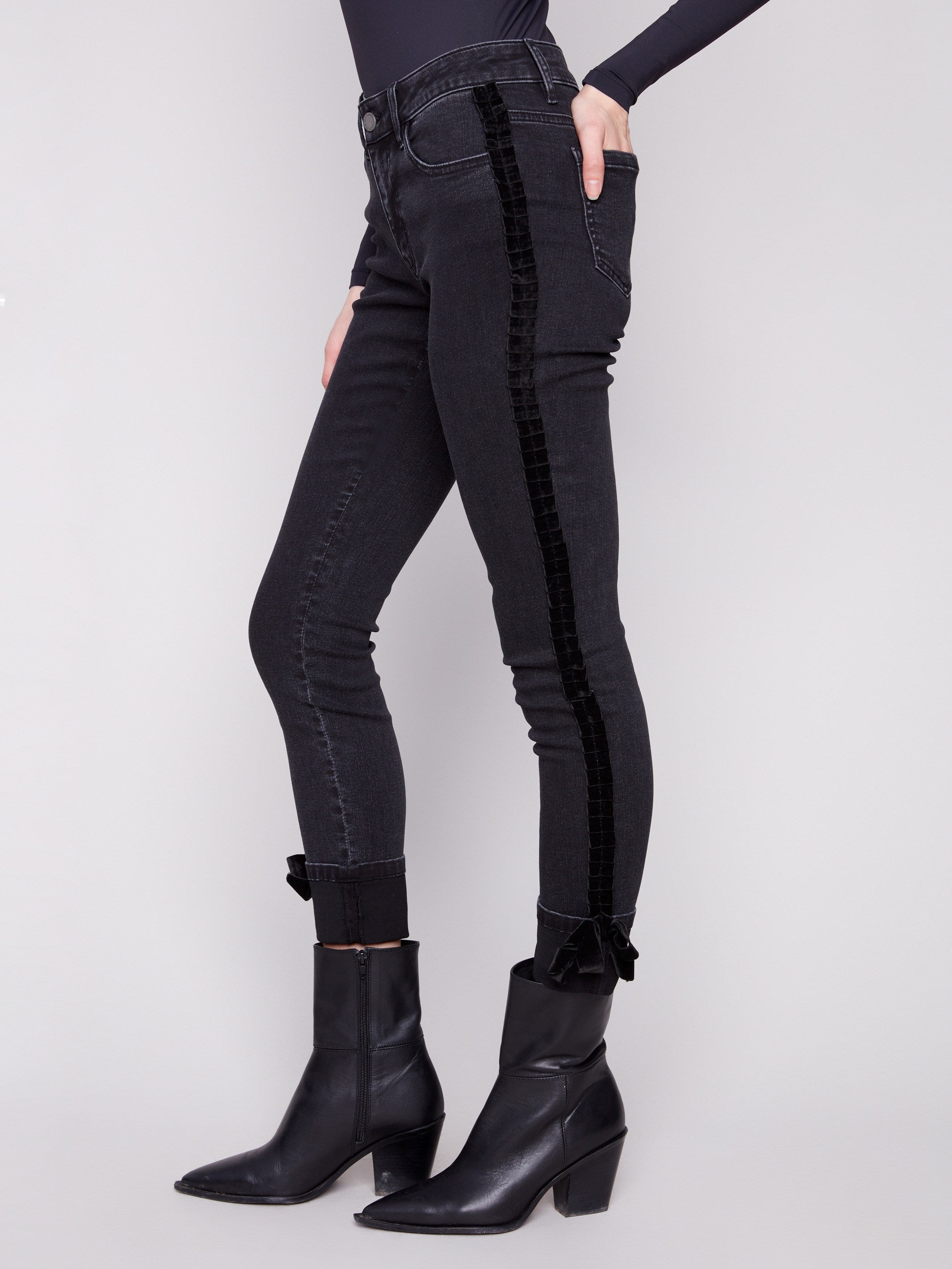 Stretch denim charcoal jeans with elegant velvet bow trim along the side seams by Charlie B.
