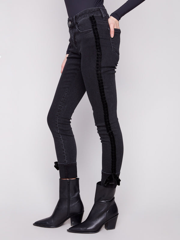 Stretch denim charcoal jeans with elegant velvet bow trim along the side seams by Charlie B.