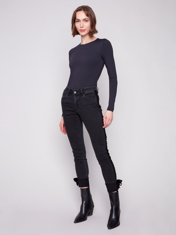 Jeans in charcoal crafted from stretch denim fabric ensure flexibility and ease of movement by Charlie B.
