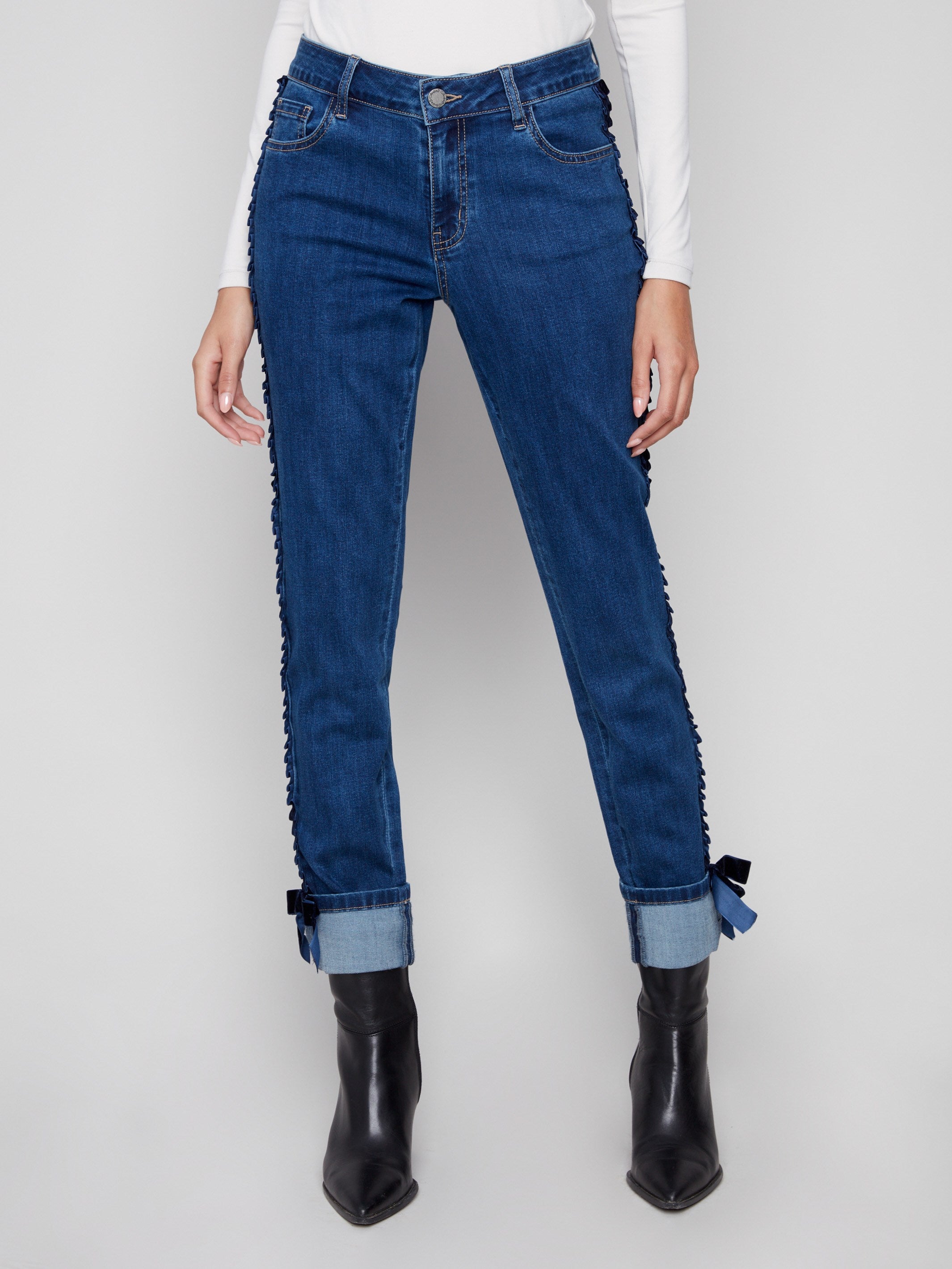Enjoy the regular rise of these indigo jeans, complete with folded hems and chic velvet bow details by Charlie B.