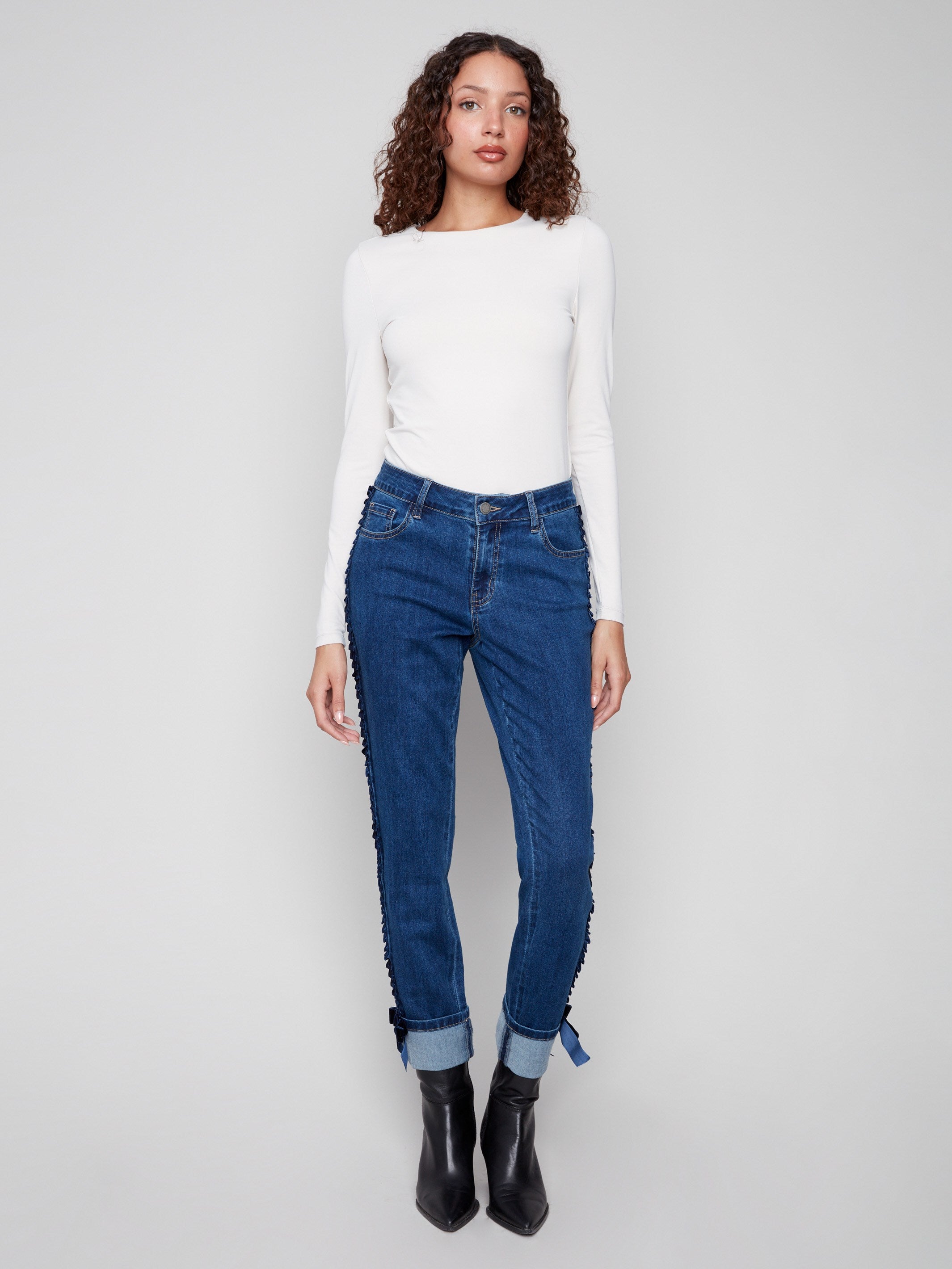 Indigo slim leg jeans crafted from stretch denim fabric offer comfort and style with unique detailing by Charlie B.