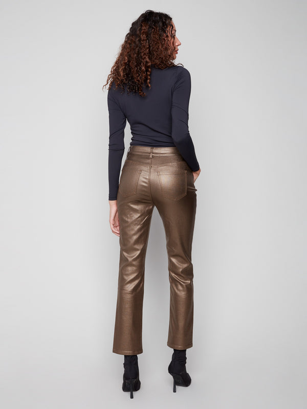 Crafted from luxurious stretch twill fabric, these copper metallic pants boast an elegant slim fit design by Charlie B.