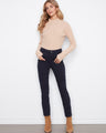 These pants feature a slim leg design, offering a sleek silhouette perfect for versatile styling. By Charlie B.