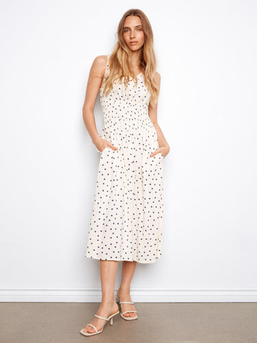 Polka-dotted dress with hidden pockets and a flattering smocked waist by Charlie B.