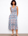 This dress features a flattering V-neck design that complements its elegant pattern. Perfect for any occasion. By Charlie B.