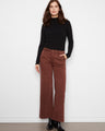 These pants feature a wide leg design, offering a stylish silhouette for any occasion. By Charlie B.