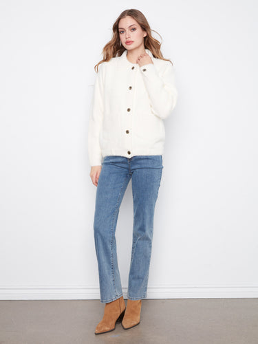 Crafted from soft fuzzy knit material, this jacket offers warmth and comfort with its stylish button-front closure by Charlie B.