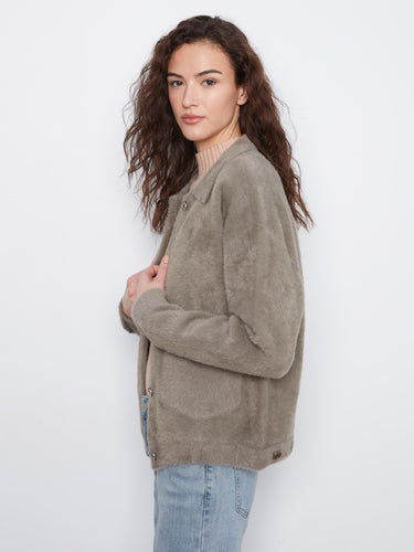 The button-front closure adds functionality and flair to this versatile jacket, ideal for layering. By Charlie B.