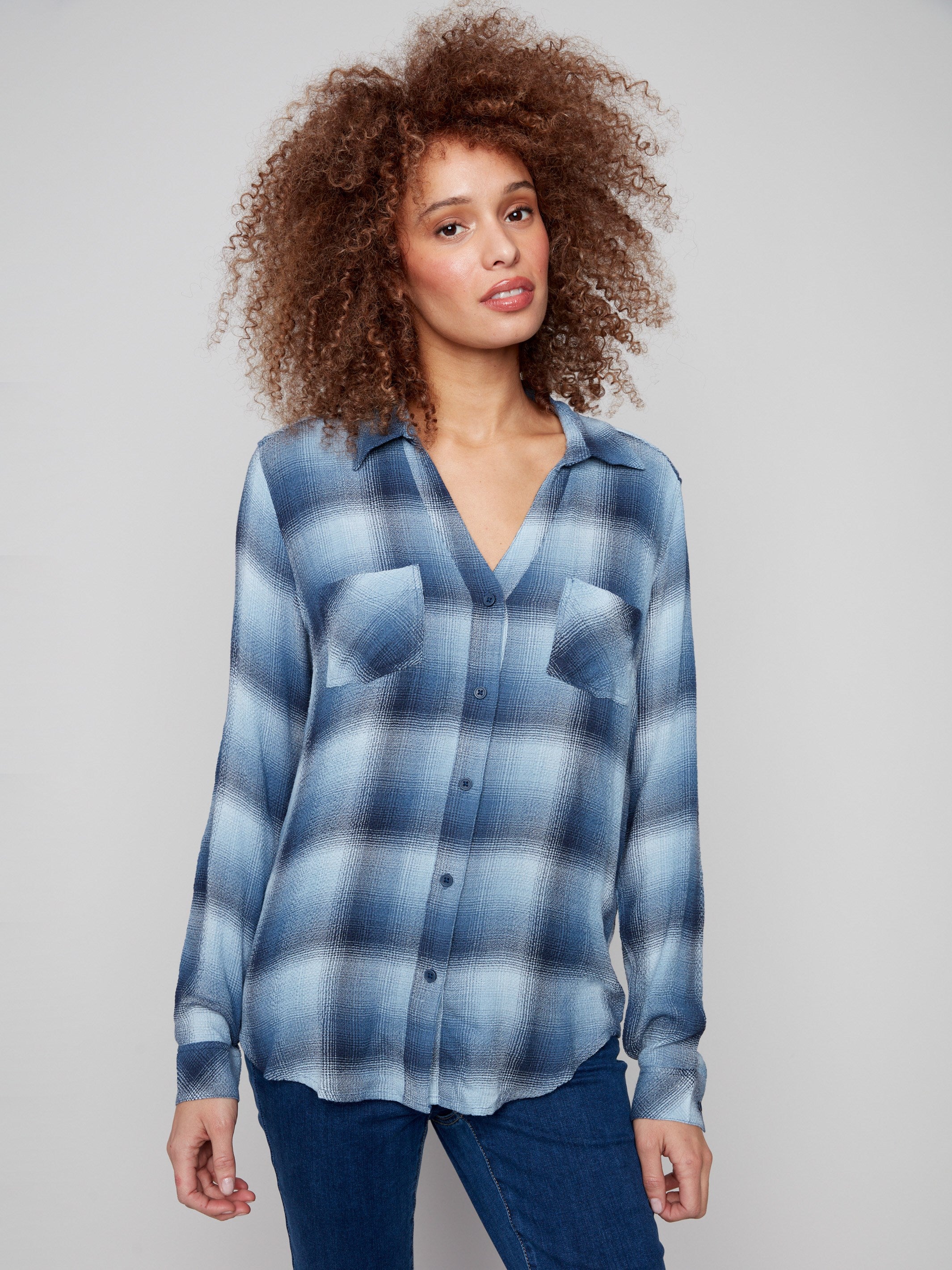 Blue plaid blouse featuring a classic shirt collar for a timeless look by Charlie B.