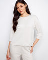 Subtle blanket stitch detailing elevates this piece with an understated charm that complements its cozy design by Charlie B.