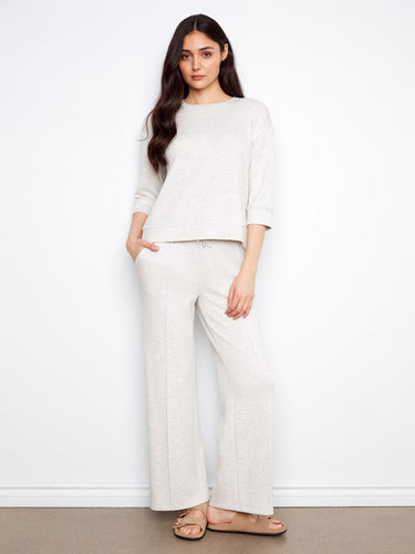 Elevate your wardrobe with this timeless piece offering stylish 3/4 sleeves and unmatched comfort. Expertly made by Charlie B.