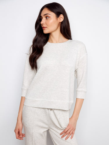 A must-have staple with intricate blanket stitch detailing that enhances its minimalist appeal. By Charlie B.