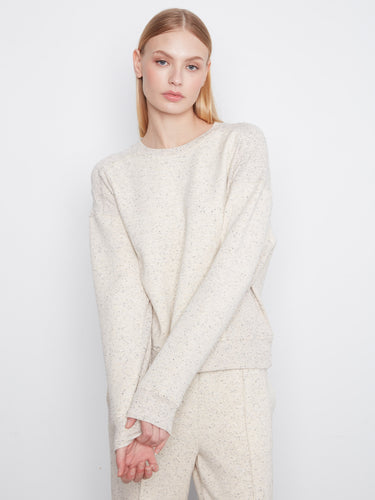 Long-sleeve crew neck sweatshirt made from soft scuba fabric with ribbed side panels. Styled by Charlie B.