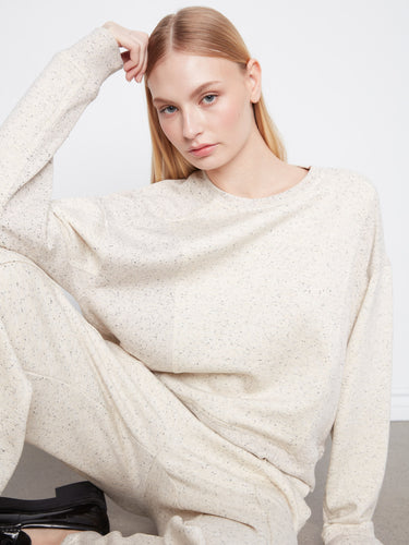 This relaxed fit sweatshirt features ribbed cuffs and hem, crafted from the finest soft scuba fabric by Charlie B.
