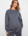Soft scuba fabric sweatshirt with a relaxed fit, showcasing long sleeves and ribbed side panels. Designed by Charlie B.