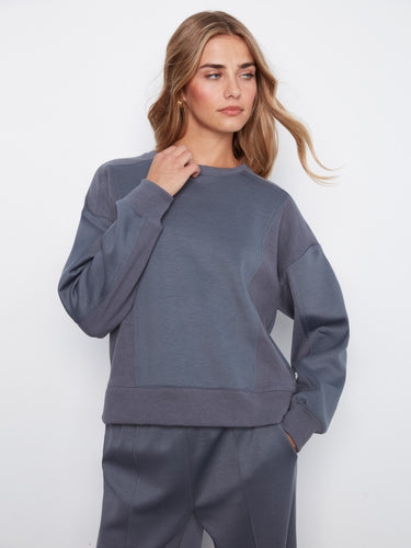 Casual yet sophisticated crew neck sweater with a relaxed fit and ribbed details on the sides. Designed by Charlie B.